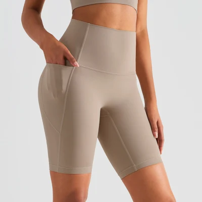 Venta al por mayor OEM/ODM mujeres entrenamiento cintura alta Yoga bicicleta pantalones cortos deportivos con bolsillo lateral sin punta de camello gimnasio Fitness correr pantalones cortos de ciclismo sin costuras